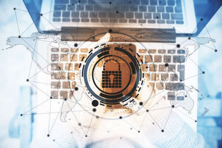 Top view of hands using laptop and smartphone with creative glowing digital padlock interface....