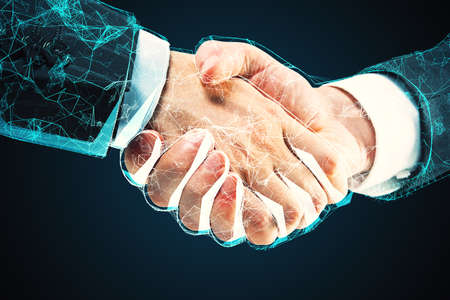 Abstract polygonal handshake on dark background. AI and partnership concept.の写真素材