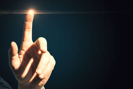 Hand pushing a flare buttom of digital interface. Technology and communication concept.