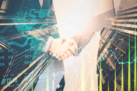 Businessmans in suit shaking hands with glowing stock chart. Money and trade concept. Multiexposure