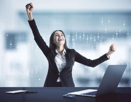 Happy businesswoman and financial analytics interface on virtual screen. Trade and business analysis conceptの写真素材