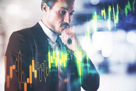 Businessman and business report hologram on virtual screen. Business and financial success concept....