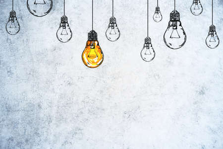 Drawing glowing light bulbs on gray concrete wall. Leadership and Idea concept. 3D Renderingの写真素材