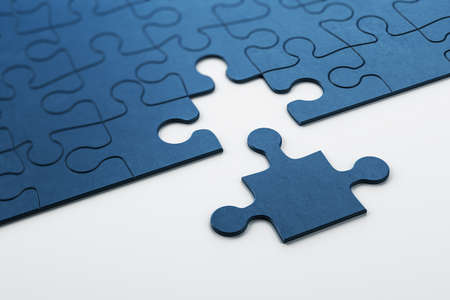 Plain blue jigsaw puzzle on white background. Business and teamwork concept. 3D Rendering