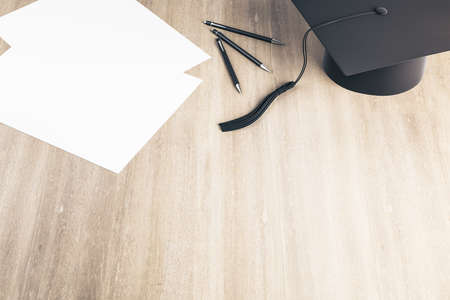 Graduation cap and paper on wooden table. Business and education concept. 3D Rendering