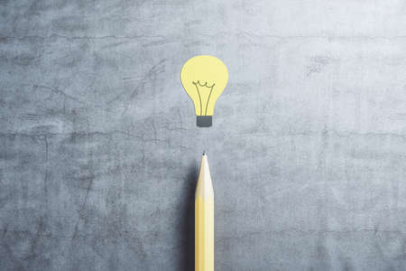 Drawing yellow lamp and pencil on concrete table. Idea and startup concept. 3D Rendering