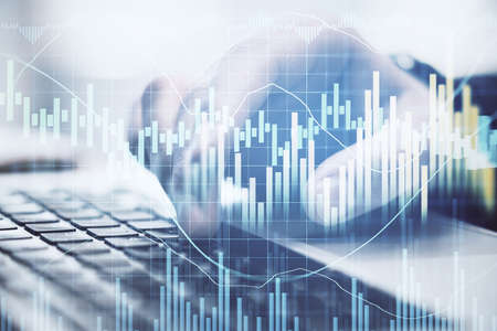 Businessman hand typing on keyboard laptop with business charts. Business and financial success...