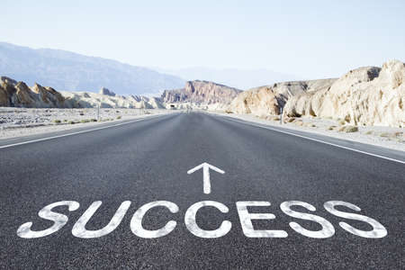 Asphalt road and a success point. Start straight for business conceptの写真素材
