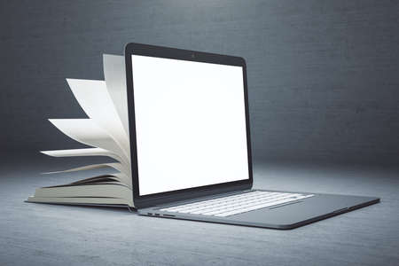 Creative open book laptop on subtle background with copy space. Mock up, Online education and...