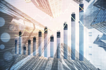 Stock marketing hologram on modern city background. Business trading concept. Double exposure