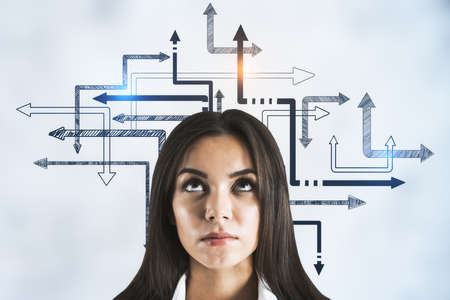 Businesswoman and drawing arrow system on over head. Business and challenge concept. Close upの写真素材