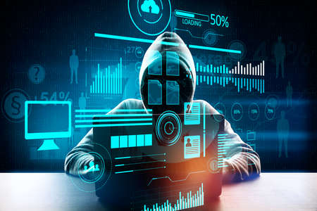 Hacker at desktop using laptop with abstract forex and big data interface on dark background. AI and...