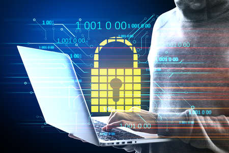 Hacker holding laptop with glowing padlock hologram. Hacking and antivirus concept.