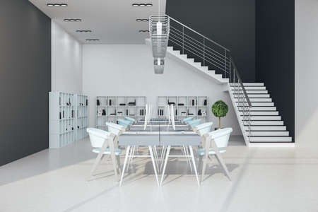 Contemporary loft office interior with computers on table and shelf with book. Workplace and remote...