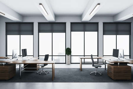 Office interior with megapolis city view and computers on wooden table. Workplace and design...