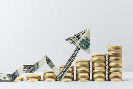 Growing chart of gold coins with dollar arrow bill. Trade and finance concept. 3D Renderingの写真素材