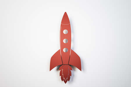 Toy red rocket on white background. Success and startup concept. 3D Renderingの写真素材