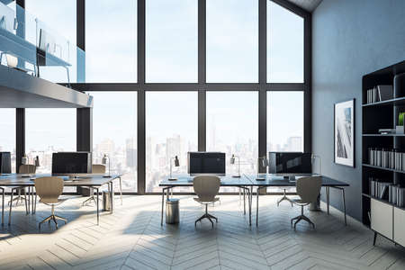 Minimalistic coworking office hall with computers on table and city view. Workplace and corporate concept. 3D Renderingの写真素材