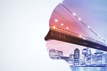 Abstract head silhouette on blurry night city background. AI and architecture concept. Double exposureの写真素材