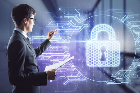 Man draws a lock symbol hologram, double exposure, digital security concept
