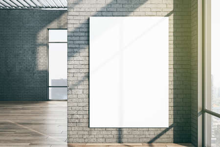 Minimalistic gallery interior with blank banner on brick wall. Presentation and art concept. Mock...