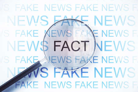 Magnifying glass with fact words on white background. Information and breaking concept. 3D Renderingの写真素材