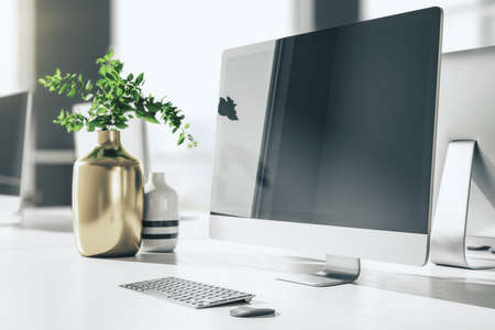 Interior of stylish office with computer on table with blank black screen. Workplace and company concept. 3d renderingの写真素材