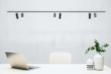 Contemporary director's office with laptop on table. 3D Rendering