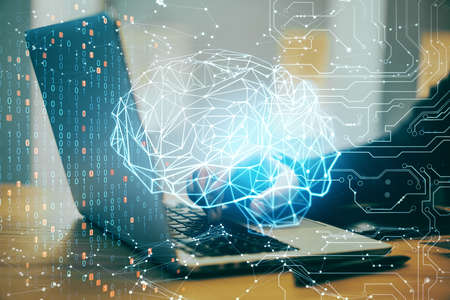 Businessman hands using laptop with AI interface. Artificial intelligence and technology concept. Double exposureの写真素材