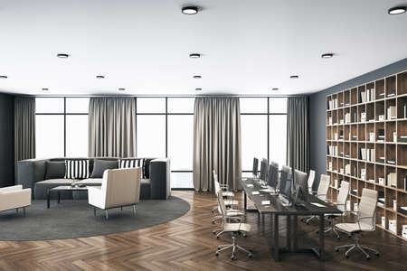 Contemporary cowrking workplace with computers, bookcase and relaxation area. Coworking workplace...