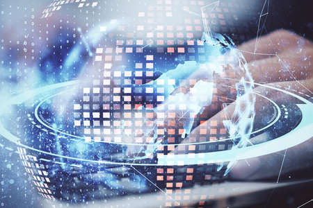Hand using laptop with digital world map hologram. Global business and interactive concept. Double...