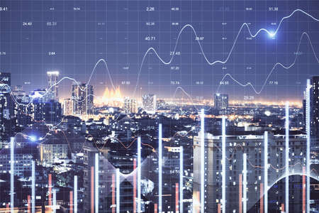 Stock analytics hologram on night city background. Business and financial success concept.