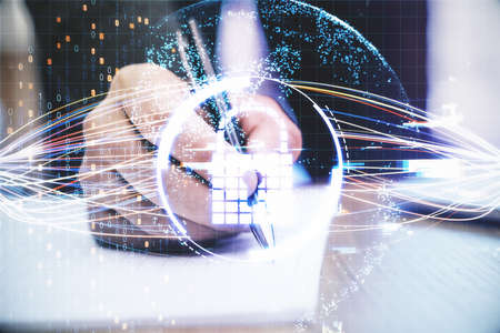 Hand writes a mark with a pen with glowing circuit padlock. Business and financial safety concept.