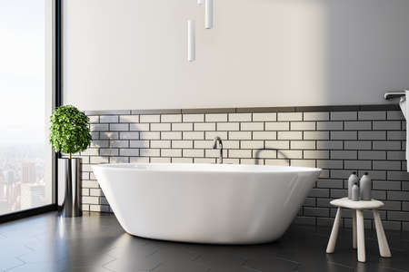 Minimalistic bathroom with white bath and city view. Design, apartment and hotel concept. 3D Renderingの写真素材
