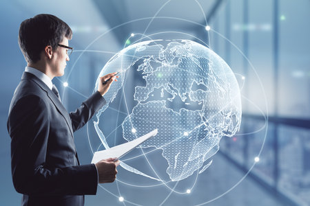 Businessman working with digital world map hologram, networking and globalization conceptの写真素材