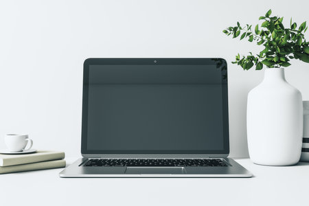 Close up of empty blank laptop on office workspace with supplies. Mock up, 3D Renderingの写真素材
