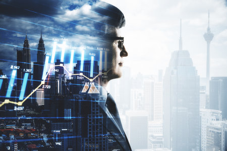 Businessman silhouette and stock report hologram on blurry city background. Business and trade concept. Close upの写真素材