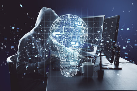 Hacker using computer in office with circuit lamp. Engineering and theft concept