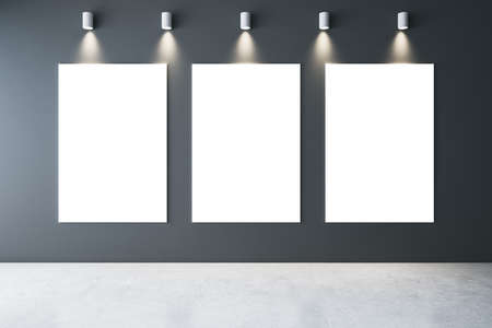 Minimalistic gallery interior with lamps on ceiling and three blank banners on wall. Art and design...