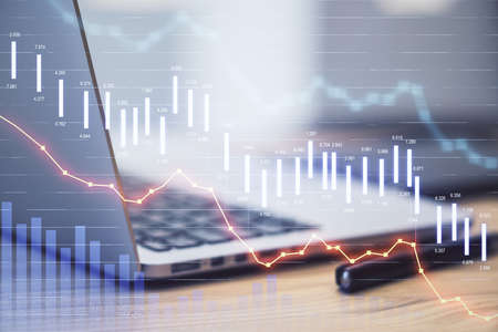 Laptop with market crash statistics on computer screen. Business and financial crisis concept. Close...