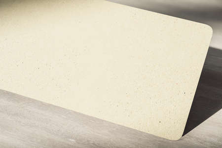 Blank eco friendly recycled paper gray color with a space four you sign at wooden background. Modern decoration concept. Mockup. 3D rendering.の写真素材