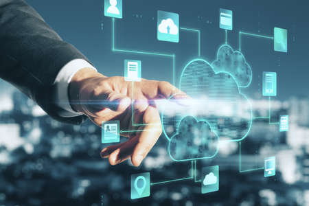 Cloud service concept with man hand touching digital screen with glowing applications icons and...