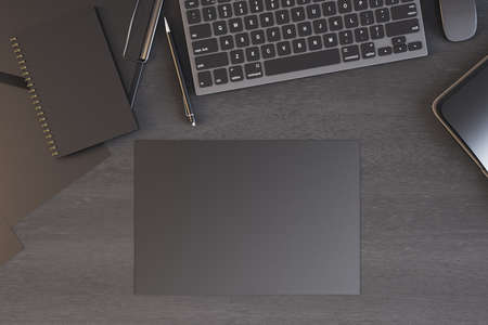 Top view of modern office desktop with laptop, supplies and empty black paper. Workplace and paperwork concept. Mock up, 3D Renderingの写真素材