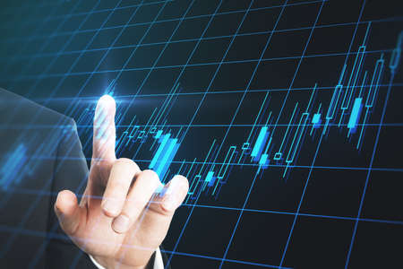 Trading analysis concept with businessman finger touching digital screen with glowing growing...