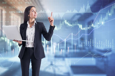 Profitable solution concept with businesswoman with laptop at digital screen with trade market chart...