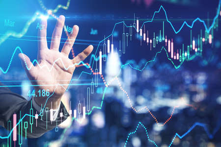 Stock market investment concept with businessman hand touching digital screen with forex chart indicators. Double exposureの写真素材