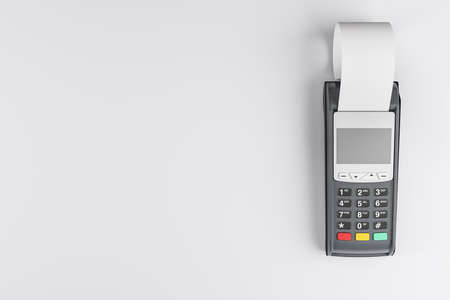 Contactless payment concept with payment terminal with cash register tape on blank light background....