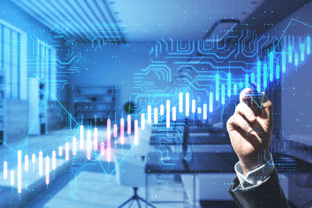 Algorithmic trading and financial concept with man hand writing on touch screen with glowing circuit...