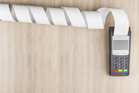 POS payment concept with wireless credit card payment terminal with cash register tape on wooden backdrop with copyspace. 3D rendering, mock upの写真素材