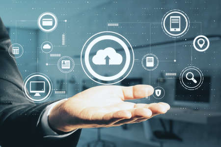 Cloud storage technology concept with man palm and digital internet service icons set above. Double...